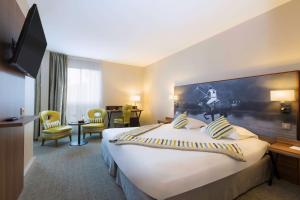 Postelja oz. postelje v sobi nastanitve Best Western Plus Hotel Du Parc Chantilly