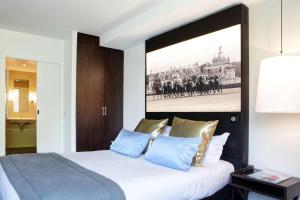 Postelja oz. postelje v sobi nastanitve Best Western Plus Hotel Du Parc Chantilly