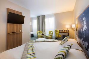 Postelja oz. postelje v sobi nastanitve Best Western Plus Hotel Du Parc Chantilly