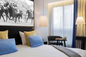 Postelja oz. postelje v sobi nastanitve Best Western Plus Hotel Du Parc Chantilly