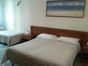 Llit o llits en una habitació de Hotel Giulia
