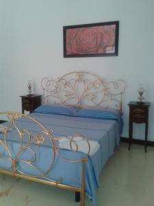 Un pat sau paturi într-o cameră la Tenuta La Spezia