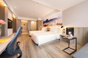 Letto o letti in una camera di Atour Hotel Guilin North Railway Station