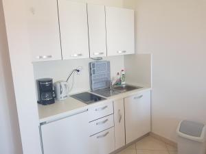Kuchyň nebo kuchyňský kout v ubytování Apartments Margita
