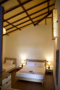 
Ein Bett oder Betten in einem Zimmer der Unterkunft Gecko Lipe Resort
