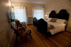 Postel nebo postele na pokoji v ubytování Locanda Capolago