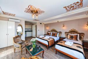 Postel nebo postele na pokoji v ubytování The Byzantium Suites Hotel & Spa