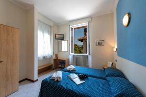 Postel nebo postele na pokoji v ubytování Hotel Boston