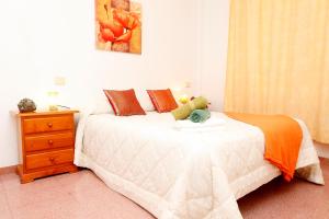 Posteľ alebo postele v izbe v ubytovaní Apartamentos Super