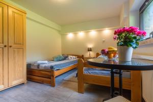 Posteľ alebo postele v izbe v ubytovaní Apartament Ewa