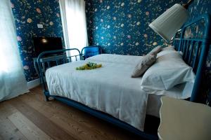 Postel nebo postele na pokoji v ubytování Locanda Capolago