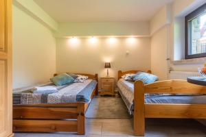 Posteľ alebo postele v izbe v ubytovaní Apartament Ewa