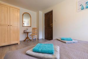 Posteľ alebo postele v izbe v ubytovaní Apartament Ewa