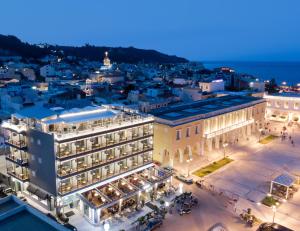 an aerial view of a city at night at Phoenix Hotel in Zakynthos