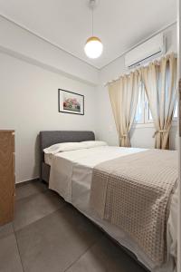 Ein Bett oder Betten in einem Zimmer der Unterkunft AthensBlues Kolonaki