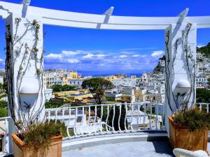 a view of the city from the balcony of a villa at La Terrazza in Capri