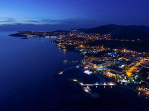 an aerial view of a city at night at La Blanche Resort & Spa in Turgutreis