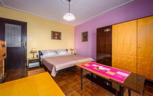 Postel nebo postele na pokoji v ubytování Apartment Crveni