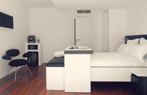 Cama ou camas em um quarto em Le Grand Hotel de la Plage