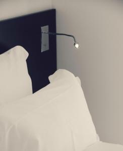 Cama ou camas em um quarto em Le Grand Hotel de la Plage