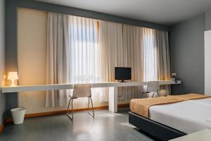 Postel nebo postele na pokoji v ubytování Basic Braga by Axis