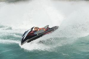 a man riding a jet ski in the water at Cimer SafraMarine Beach Resort in Safra