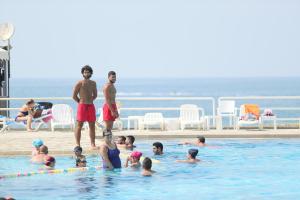a group of people in a swimming pool at Cimer SafraMarine Beach Resort in Safra
