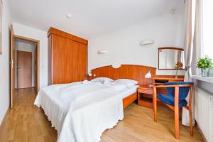Posteľ alebo postele v izbe v ubytovaní Apartamenty Sun & Snow w Rezydencji Bielik