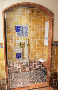 a bathroom with a shower with tiles on the wall at Europe Villa Cortes GL in Playa de las Americas