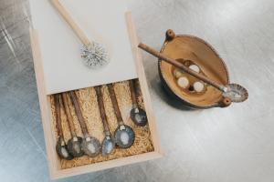 a wooden box filled with different types of eggs and a bowl at Europe Villa Cortes GL in Playa de las Americas