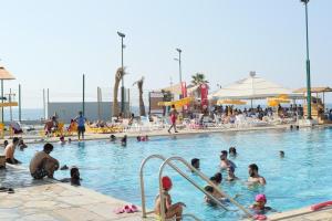 a group of people in a swimming pool at Cimer SafraMarine Beach Resort in Safra