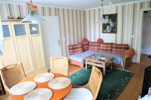 a living room with a couch and a table at Altes Gärtnerhaus in Lübben