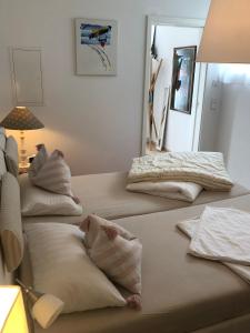 two beds in a room with pillows on them at Ferienwohnung Burgenblick mit Blick auf Riedenburg in Riedenburg