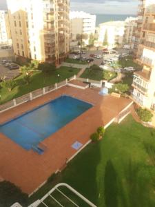 Vista de la piscina de apartamento en primera linea de playa o alrededores