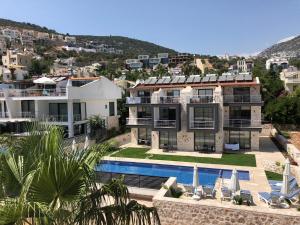 an aerial view of a house with a swimming pool at Stone House Aparts 2 plus 1 mit Poolterrasse Kalkan No 2 in Kalkan