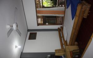 an overhead view of a tiny house with a window at Raditia Homestay in Ubud