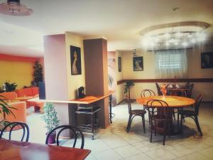 a dining room with a table and chairs at Penzion Fontis Terrae in Martinske Hole