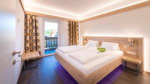 Posteľ alebo postele v izbe v ubytovaní Apartments Presslauer - Mori + 37 fotografií