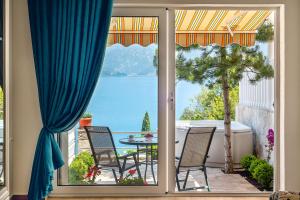 a view of a patio with a table and chairs at Boka Apartments in Tivat