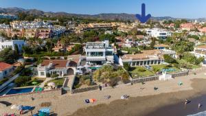 an aerial view of a beach and buildings at Casa Blue Vista - villa & guestroom in Marbella