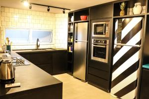 A cozinha ou kitchenette de Artsy Vitoria Hostel