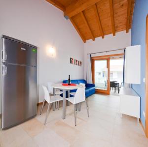 Kuchyň nebo kuchyňský kout v ubytování Villaggio Laguna Blu
