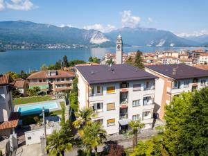 a city with a clock tower and a body of water at Castagnola 8 in Verbania
