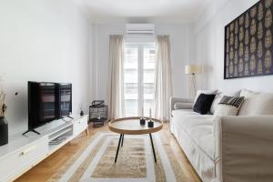 A television and/or entertainment centre at Urban 2BD Apartment in Koukaki by UPSTREET