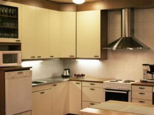A kitchen or kitchenette at Holiday Home Kurrela by Interhome