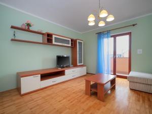 a living room with a tv and a coffee table at Holiday Home Mario 1 by Interhome in Hreljići