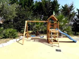 a playground with a slide and a swing at Zio Tonino in Termoli