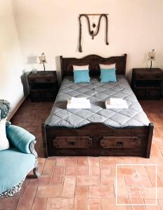 A bed or beds in a room at Quinta do Carmo