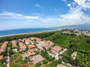 an aerial view of a house and the ocean at B&B Pineta Mare in Lamezia Terme