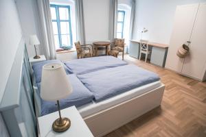 Postel nebo postele na pokoji v ubytování Penzion Masarykova 37 Hluboká nad Vltavou
